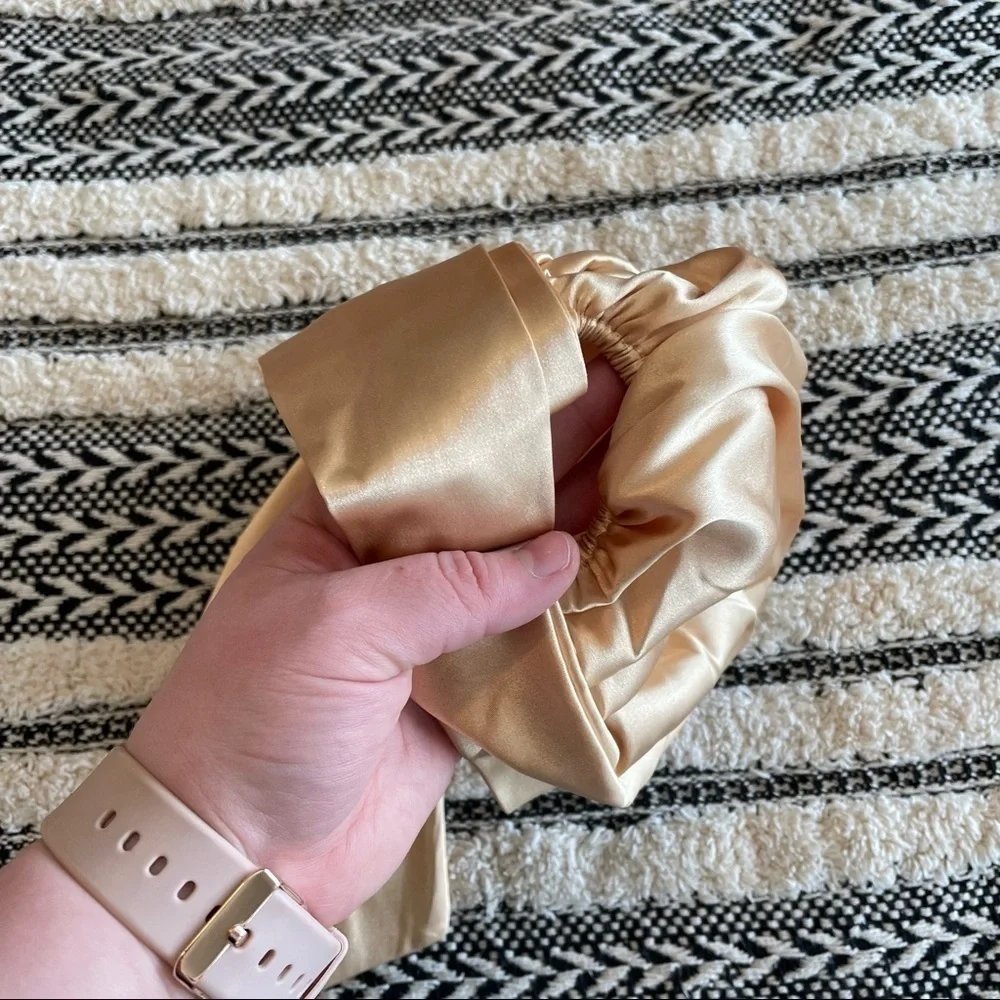 New in package gold colored satin surturban one size